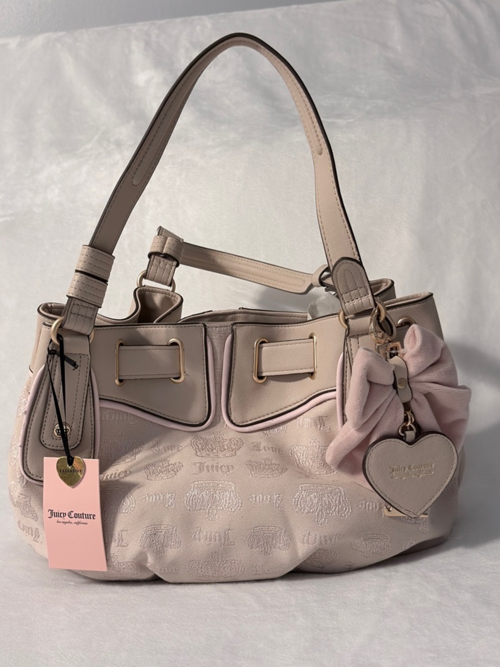 Juicy Couture Pale Pink Sand Satchel with Heart Charm and Bow Accent